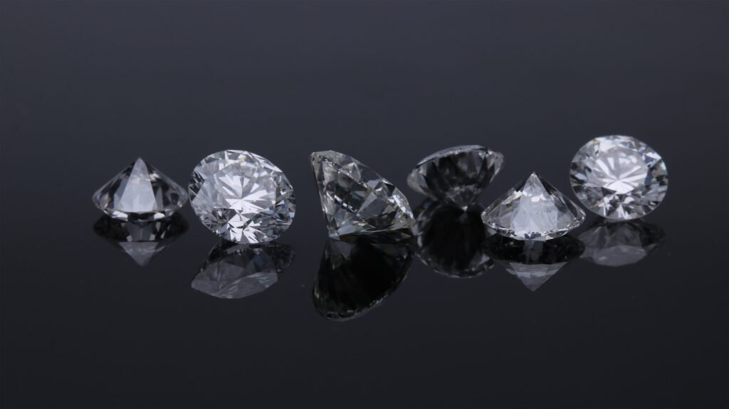 6 diamonds on a black table top