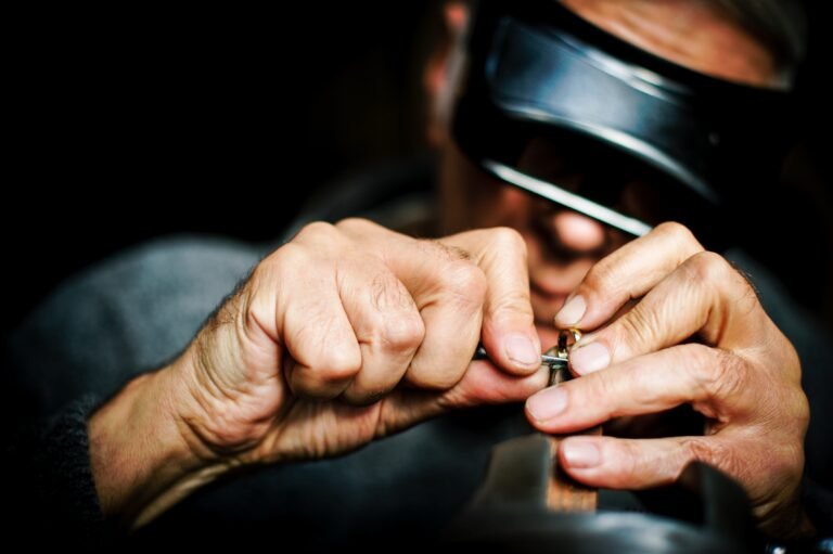 Image of a goldsmith working on a gold ring