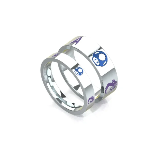 Game design wedding rings in 14k white gold with coloured enamels by Bruce Trick