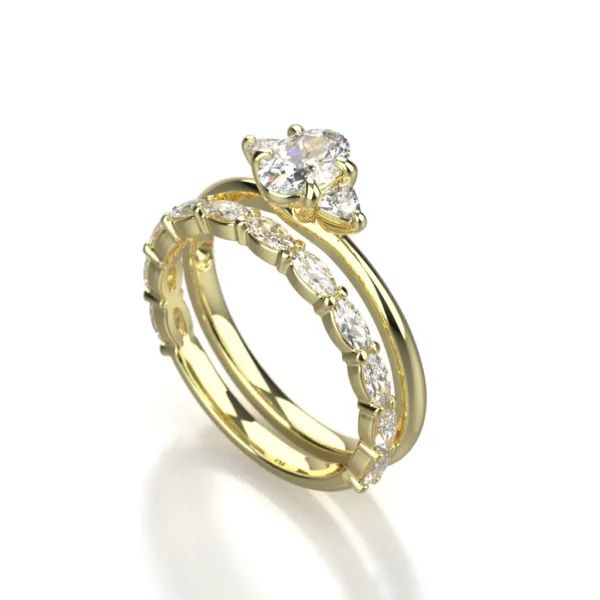 Diamond and 14k yellow gold engagement ring and wedding ring set by Bruce Trick
